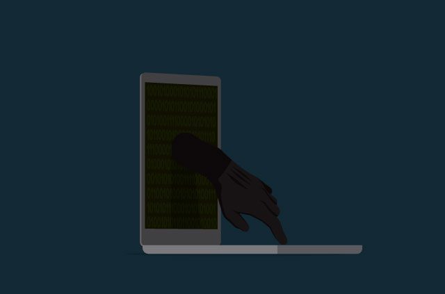 A sinister hand emerges from a laptop screen.