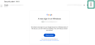 A Gmail message with a Google security alert. The "More" button on the right is highlighted and enlarged.